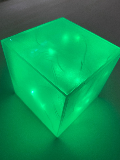 Green glowing cube
