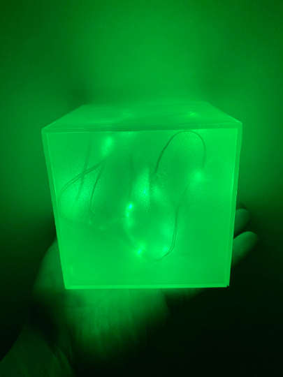 Green glowing cube